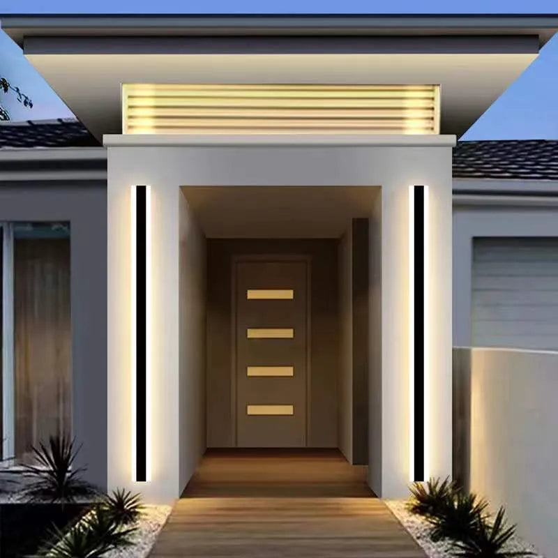 Linear outdoor wall lamp with IP65 waterproof rating and remote control for three light colours.