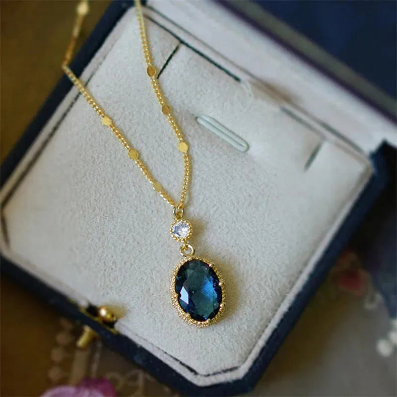 Gold geometric French retro necklace pendant on a copper chain.
