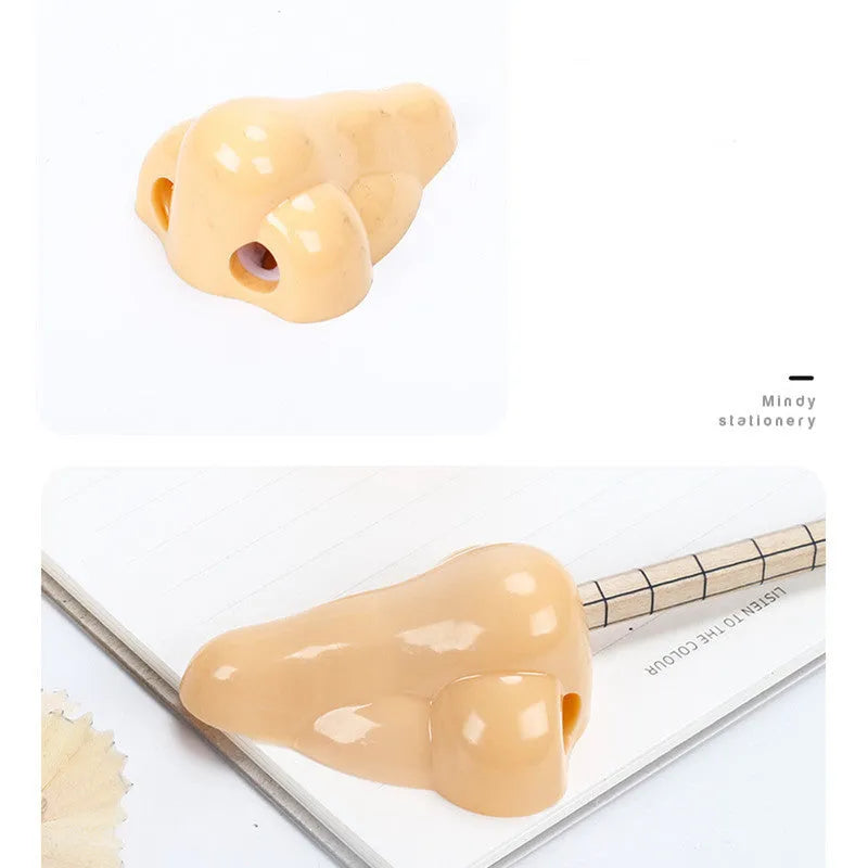 Flesh-coloured plastic student pencil sharpener with geometry design on a white background.