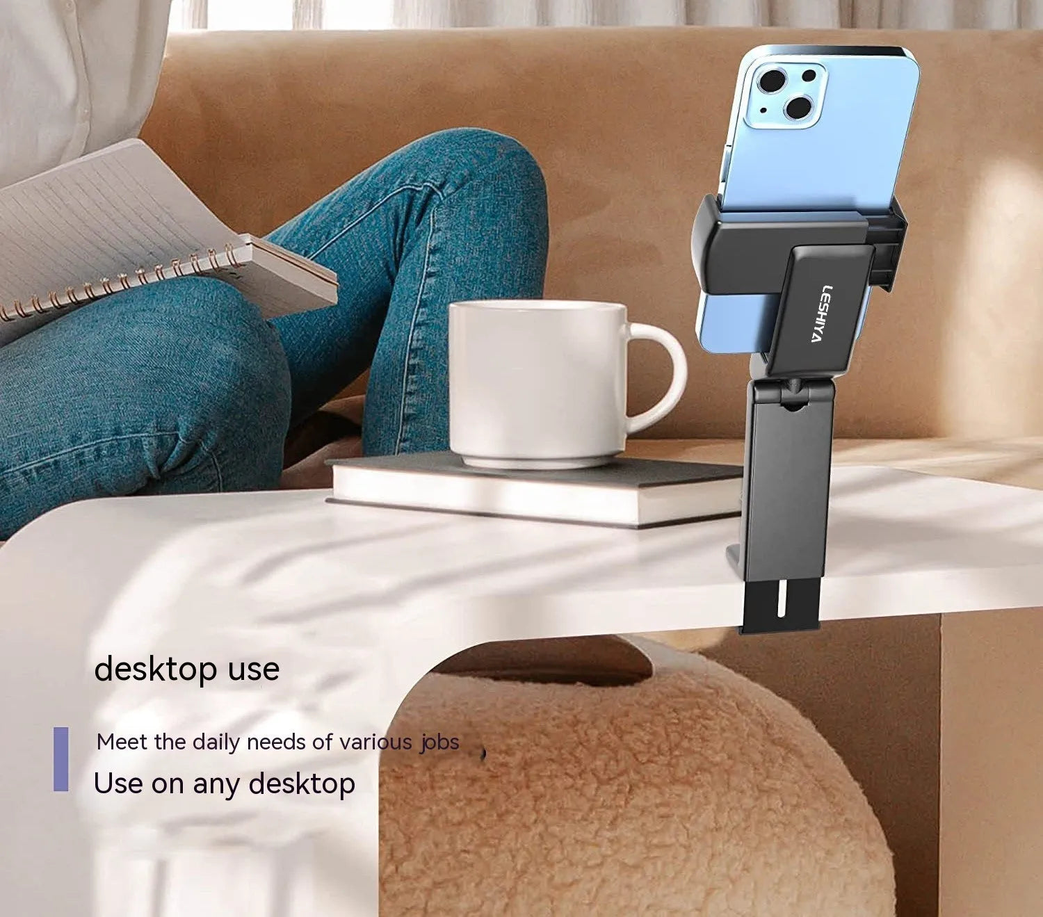 Foldable rotating universal mobile phone holder in black, shown open and closed, on a desk.