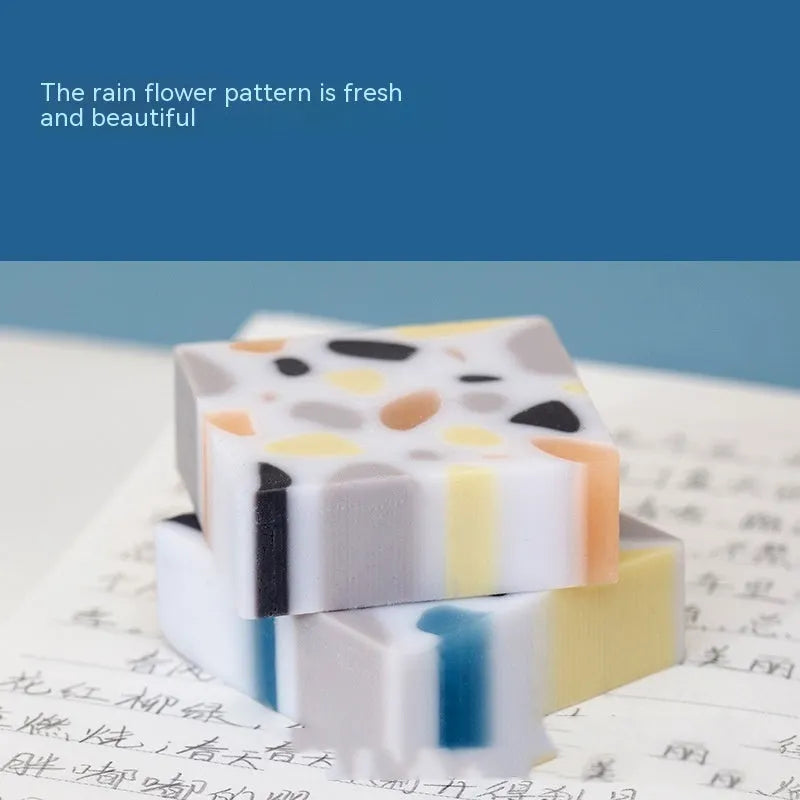 A brick-shaped, single-piece rubber eraser for traceless pencil and charcoal mark removal