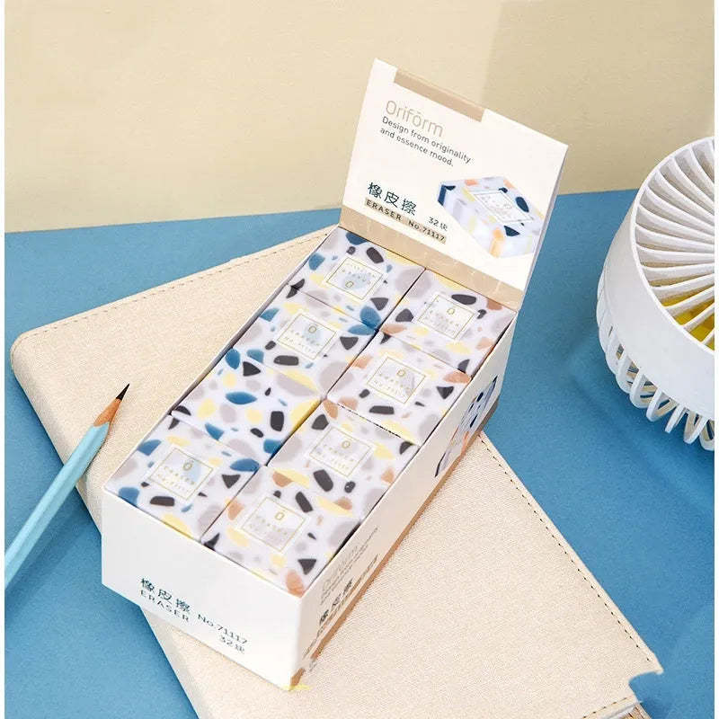 A brick-shaped, single-piece rubber eraser for traceless pencil and charcoal mark removal