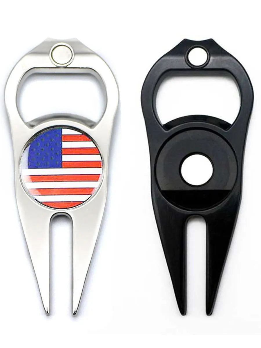 Zinc alloy golf multi-tool with ball yoke, bottle opener, and fork end on a green background.