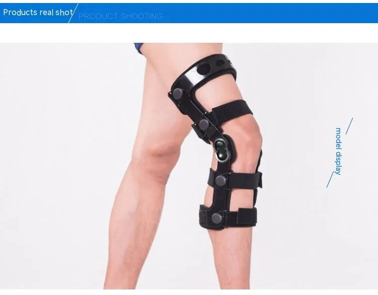 Black anterior ligament knee pad with metal stabiliser showing sandwich construction and sizing options