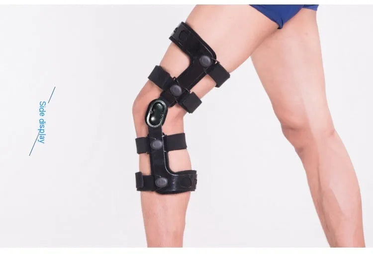 Black anterior ligament knee pad with metal stabiliser showing sandwich construction and sizing options