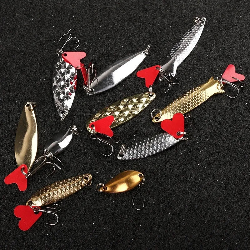 Pineapple-shaped iron fishing lure with multiple gold and silver metal sequins attached.