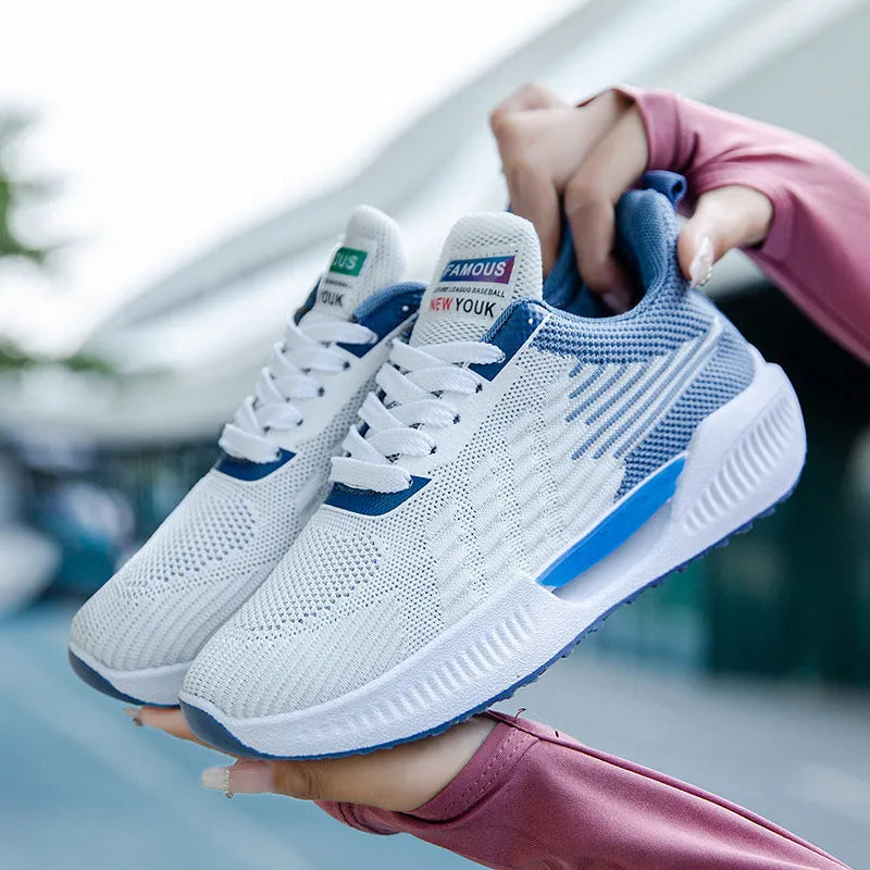 Men's blue casual mesh sports shoes with round toe and cloth upper.