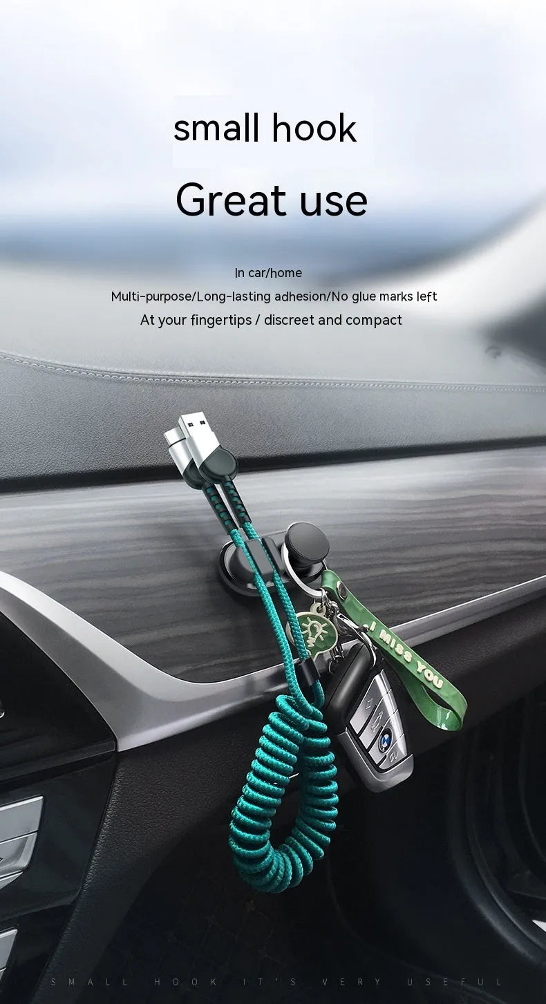 Car data cable storage hook in dark green with adhesive mount for vehicle organisation