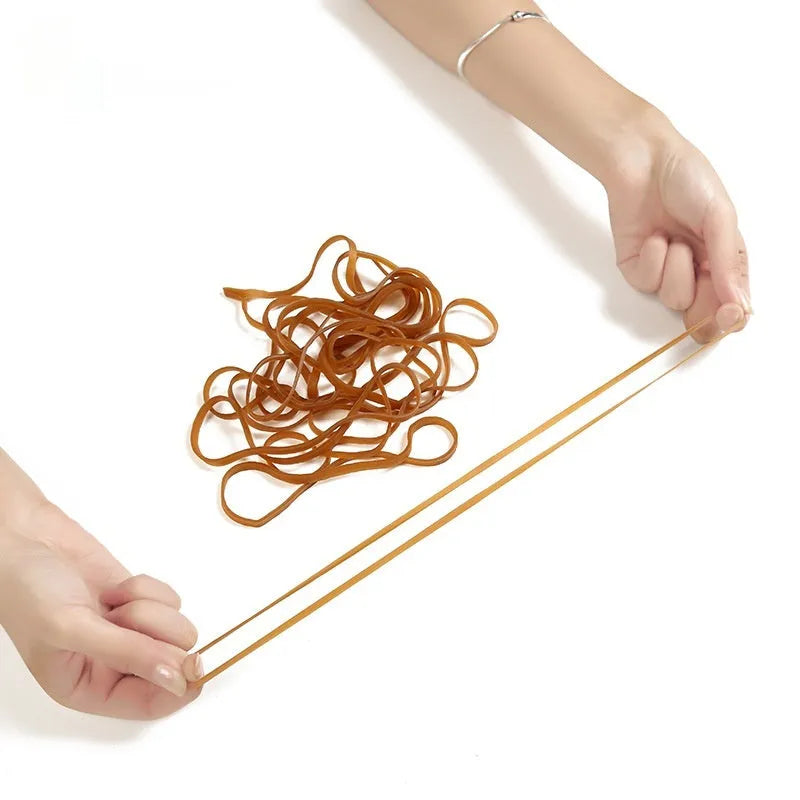 Circular natural rubber elastic bands in a 500g bulk bag for office and packaging use
