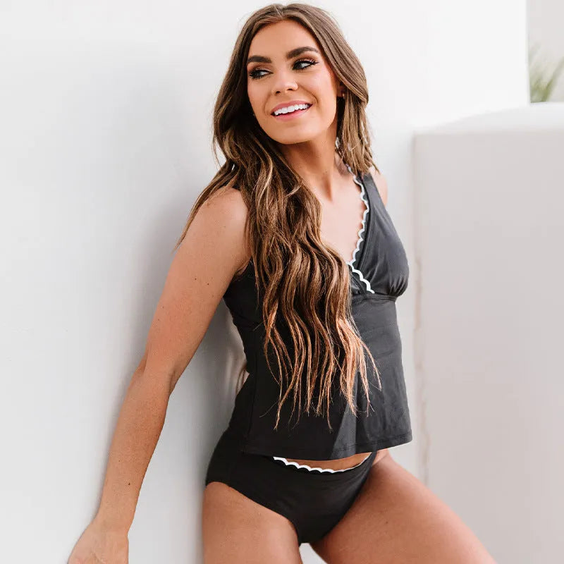 Black women's split swimsuit made from nylon fabric with sleeveless design