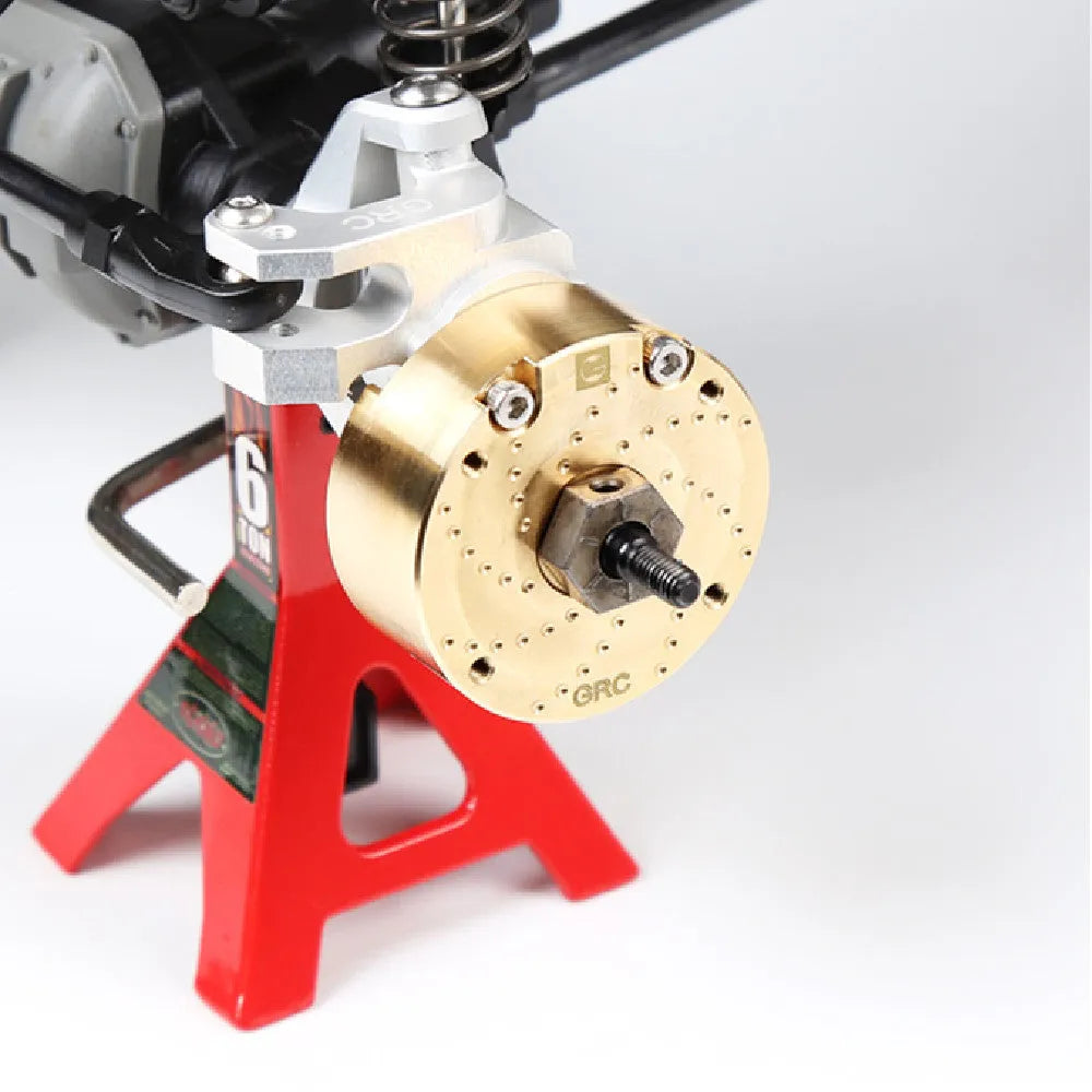 Brass gearbox cover replica metal accessory for axle door models and displays.