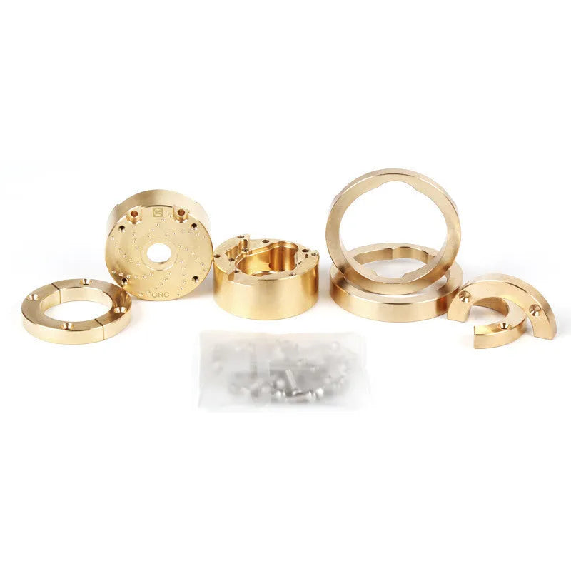 Brass gearbox cover replica metal accessory for axle door models and displays.