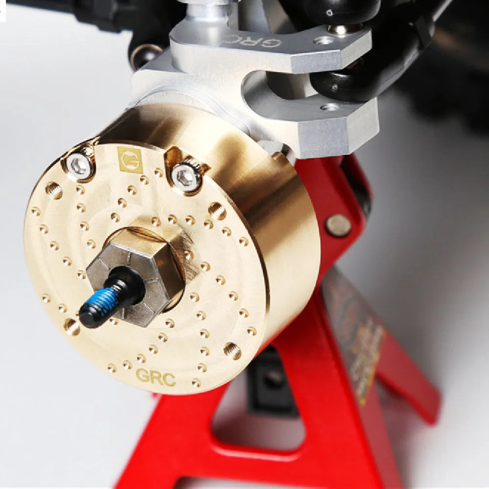 Brass gearbox cover replica metal accessory for axle door models and displays.