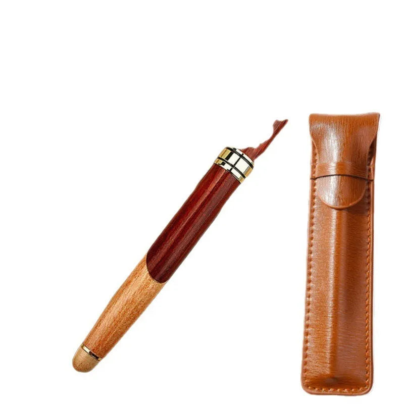 Wooden fountain pen with a metal clip next to a fabric pen bag on a desk.