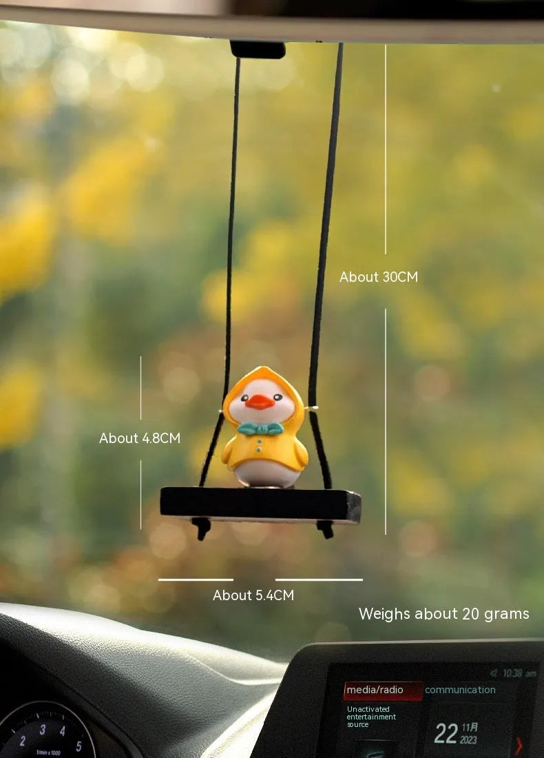 Yellow plastic duck car hanging ornament in cartoon style, shown in four design variants.