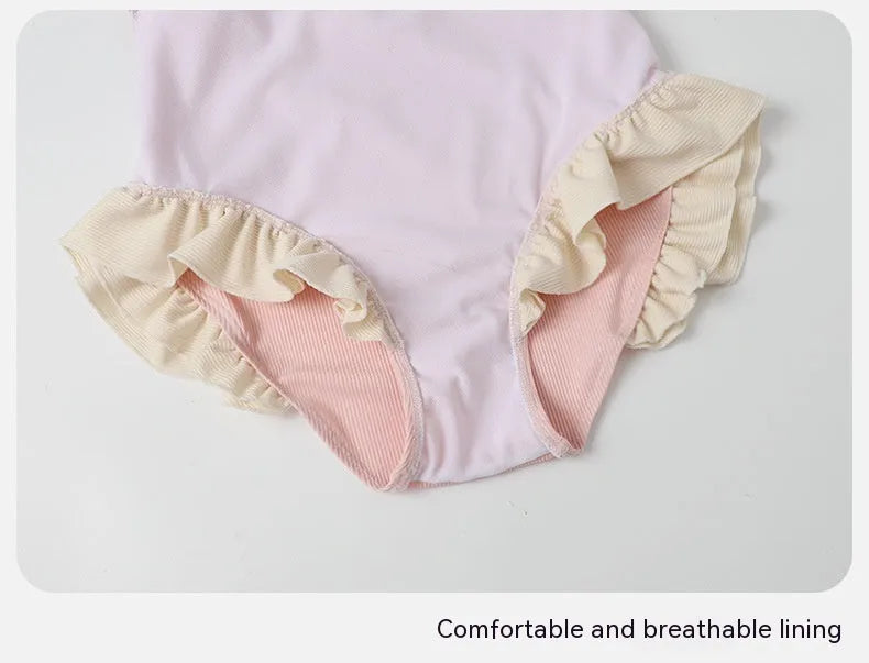 Women's pink conservative one-piece swimsuit with cute Siamese style design