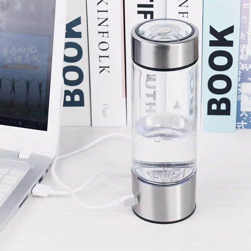 Silver hydrogen water generator bottle with borosilicate glass construction and rechargeable technology