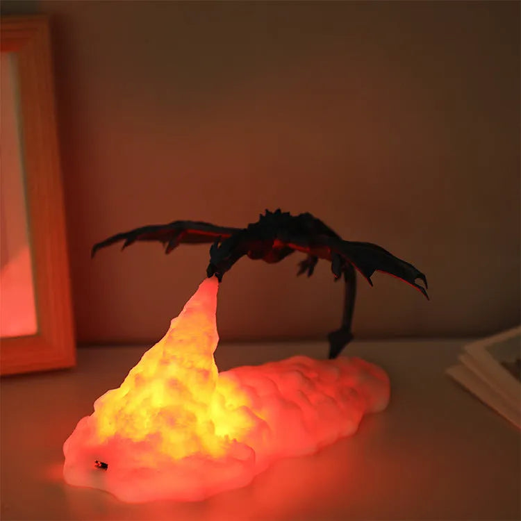 3D printed red dragon night light glowing on a bedside table