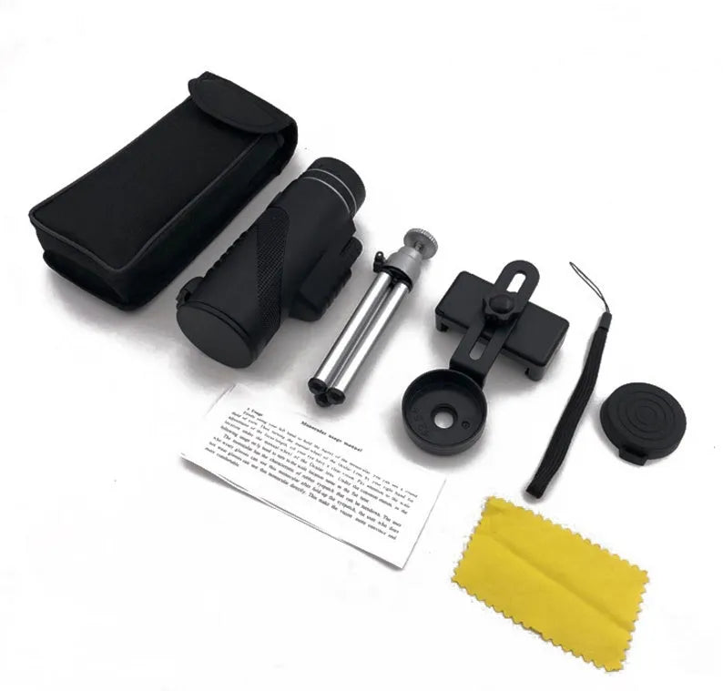 Black 40x60 smartphone monocular telescope with 144mm length on a table.