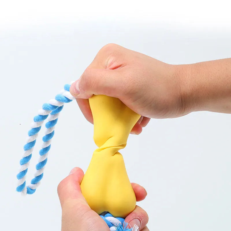 Green porous bone dog toy with rope knots for inserting treats, measuring 138x59x35mm