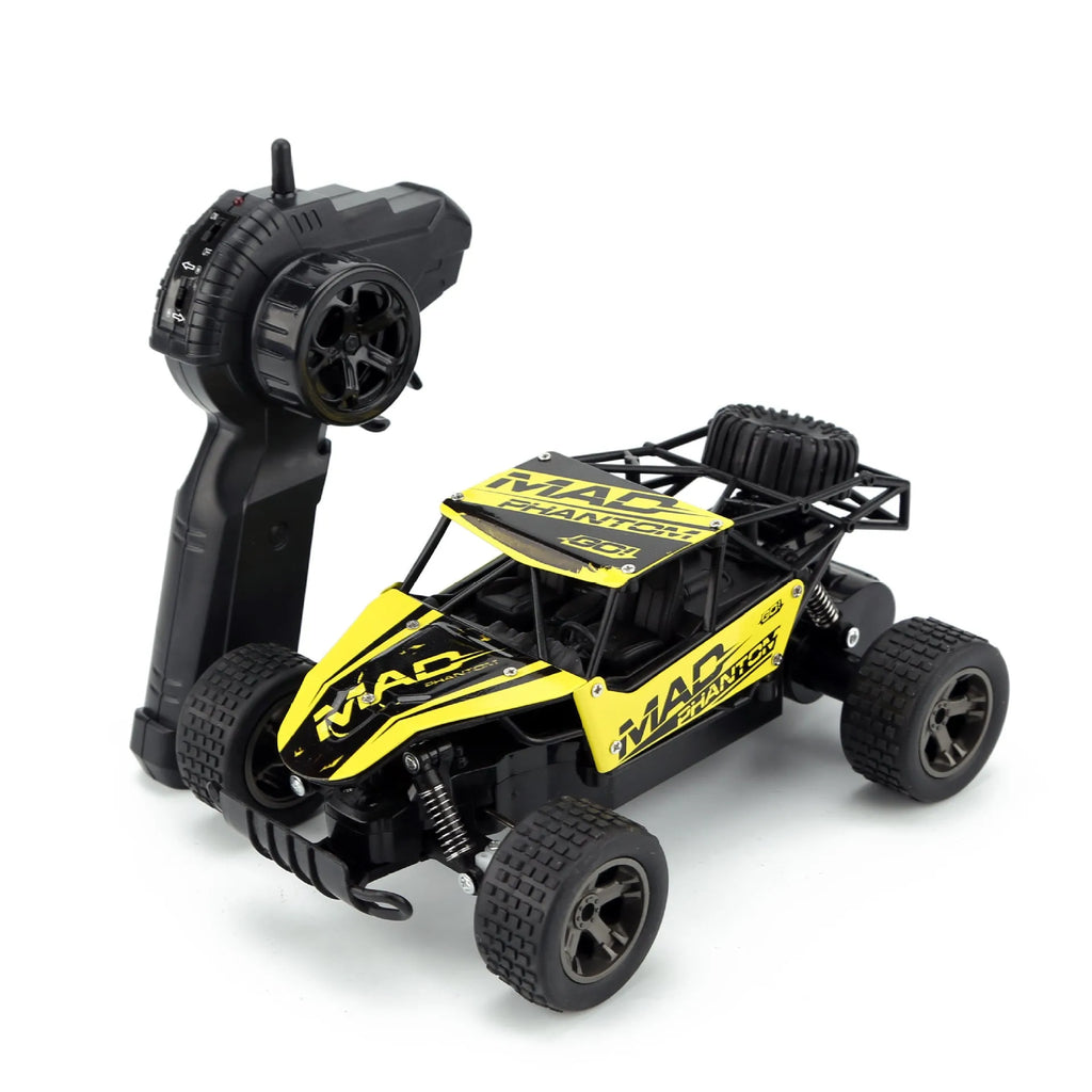 Blue 1:18 scale remote control off-road drift car with 2.4GHz remote on a grey surface.