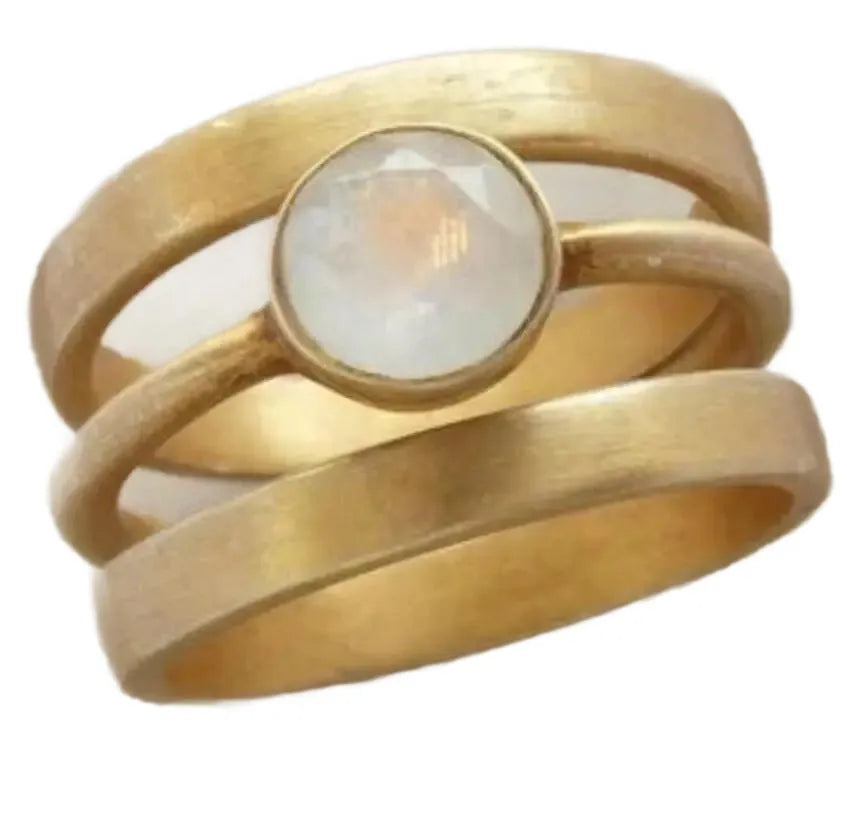 Gold-plated titanium steel geometric ring with a micro-inlaid white chalcedony stone.