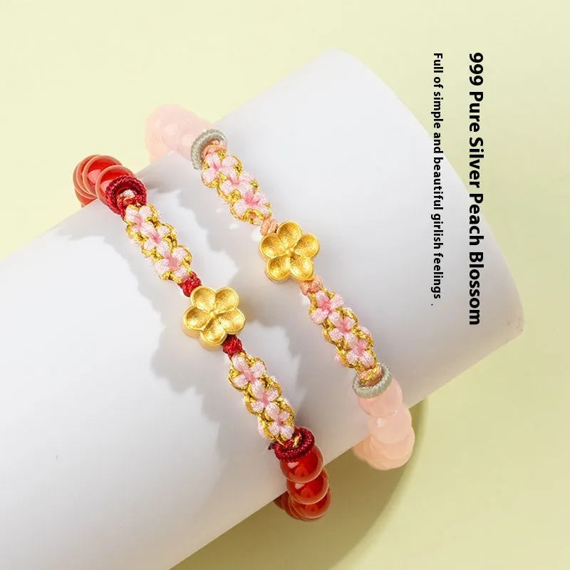 Crystal bracelet with hand-woven red rope strap and peach blossom design in diamond shape