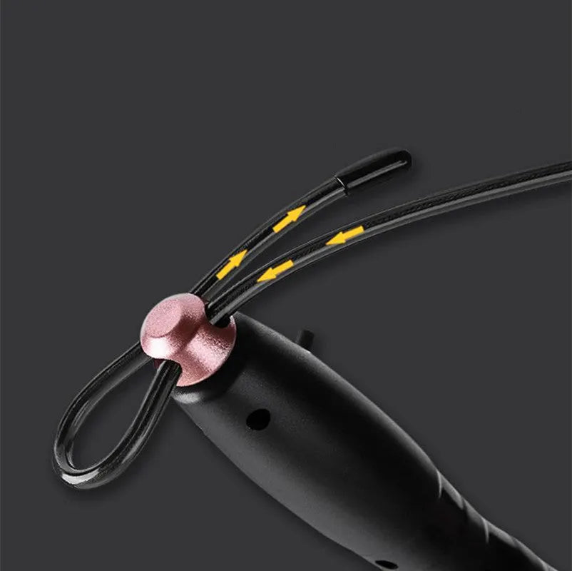Adjustable digital skipping rope with black ABS handle and TPU coated steel cable on workout mat
