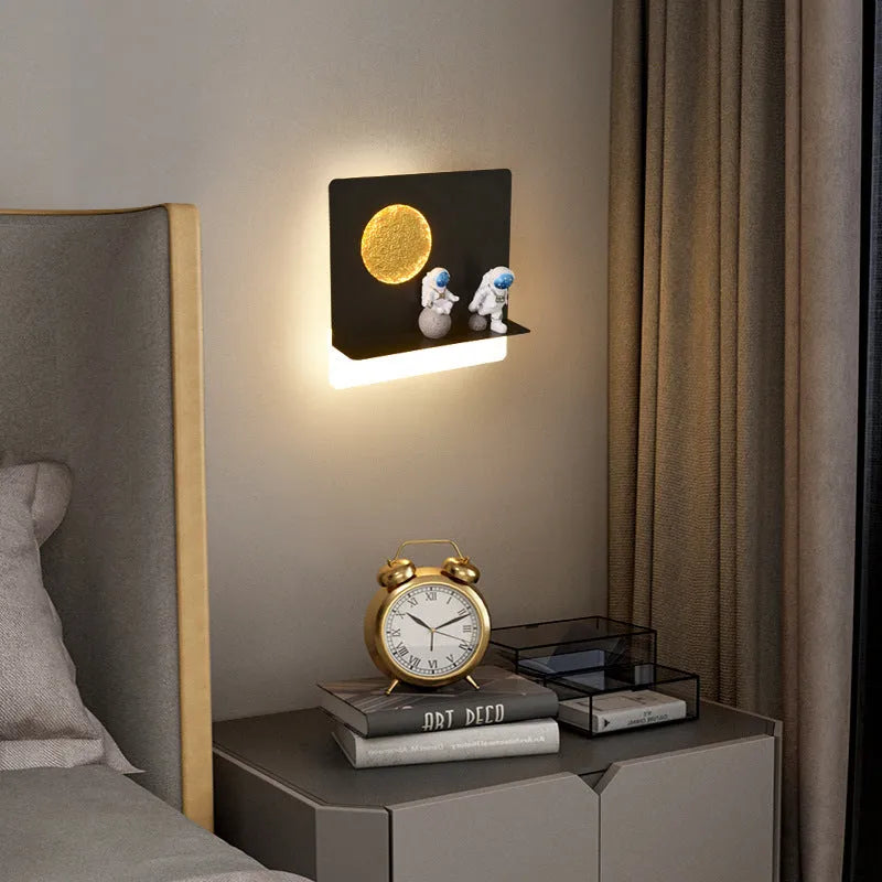 Astronaut-shaped wall lamp with shelf and LED lighting in black iron finish