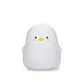 White USB rechargeable penguin-shaped night light with soft glow, shown next to its charging cable.