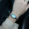Women's oval fashion watch with slim profile in gold and colour variations