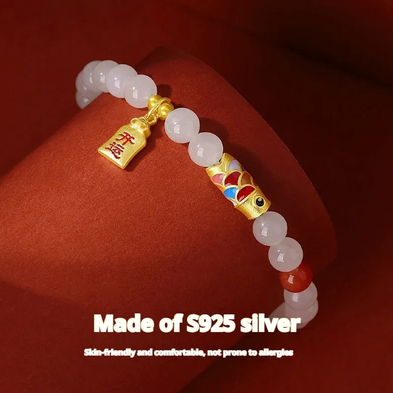 S925 sterling silver bracelet with a natural Hetian jade koi fish charm and cold enamel details.