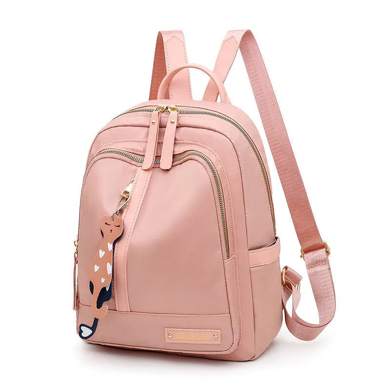 Black casual nylon backpack with shoulder straps, showing internal organiSation pockets and a soft handle.
