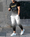 Men's short-sleeved printed pullover suit set with round neck T-shirt and matching trousers on a hanger.