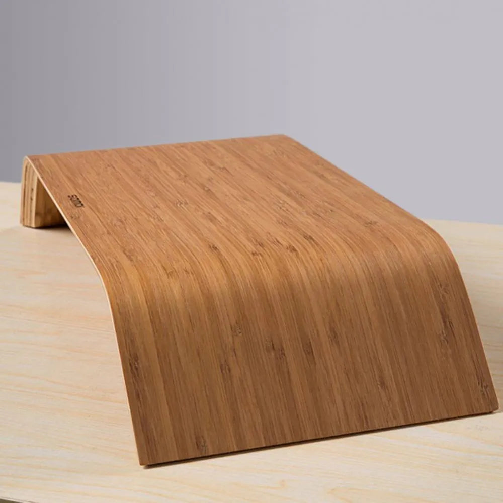Walnut stability bracket laptop stand in bamboo leather colour, 23x51x9cm, on a desk