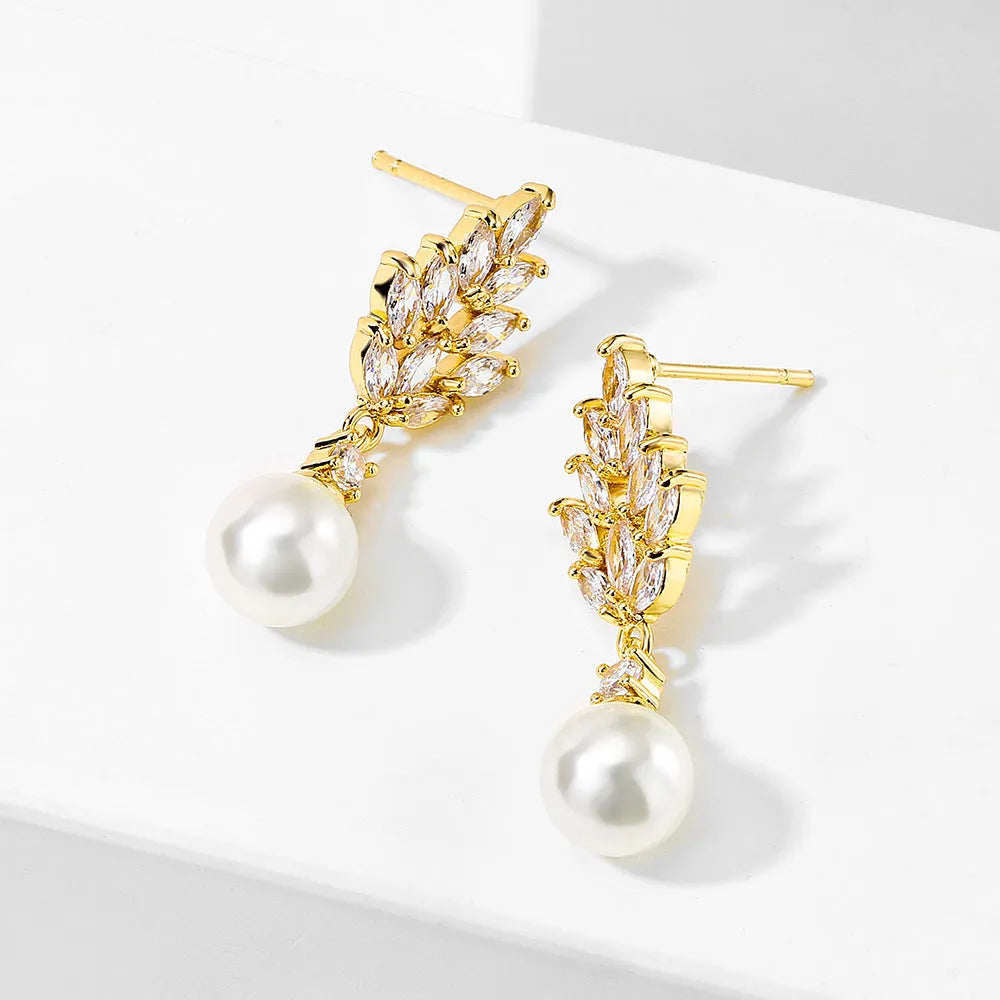 Geometric floral design earrings with micro inlaid zircon detail in gold, platinum, and rose gold finishes.