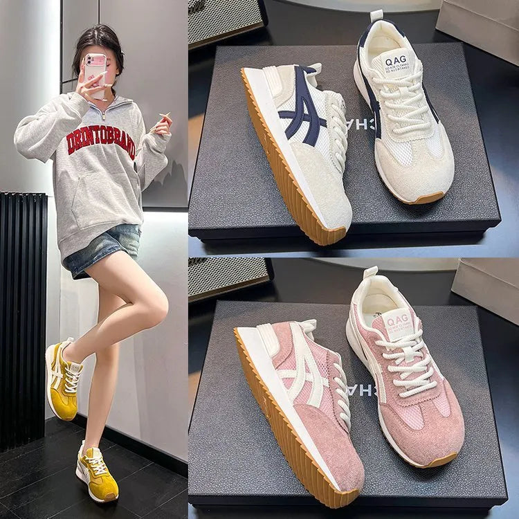 Women's white lace-up casual sneaker with round toe and flat heel on a non-slip sole.