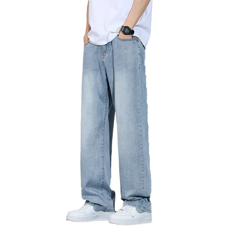 Straight leg denim trousers in a wide leg style on a hanger, showing the zip fly placket.