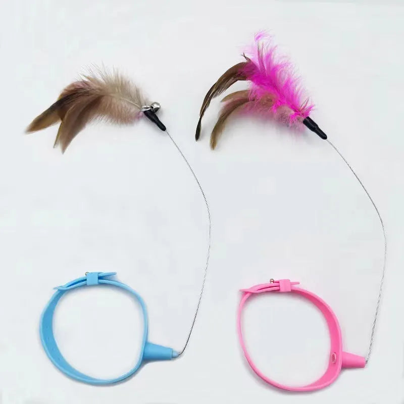 Blue adjustable cat collar with attached silicone wand and a feather and bell toy.