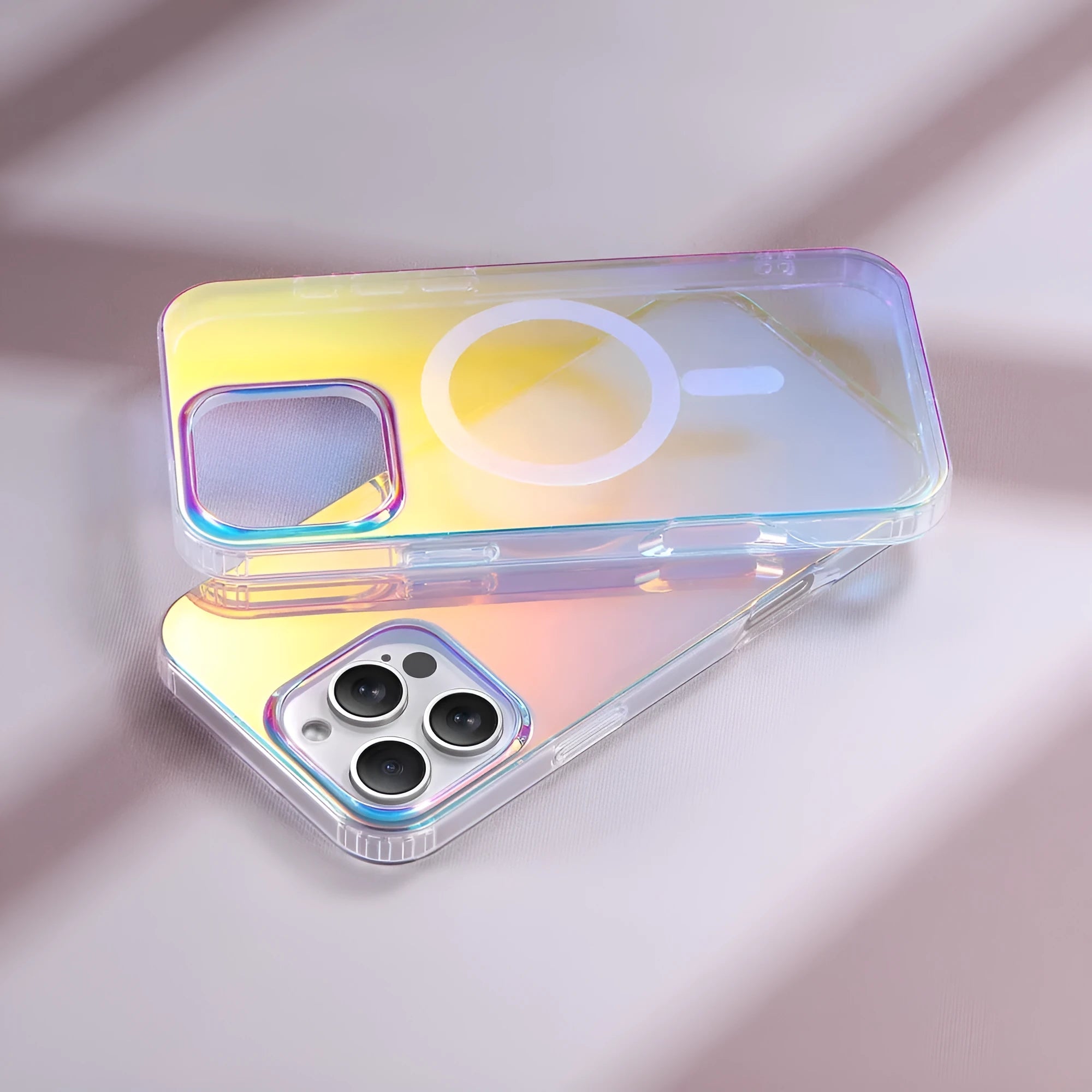 Glossy transparent magnetic case for iPhone on a table, showing chameleon colour-shift effect.