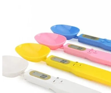 White digital kitchen spoon scale with LCD display showing weight measurement