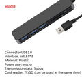 Black USB 3.0 hub with 4 Type-A ports and a 30cm connected cable on a desk.