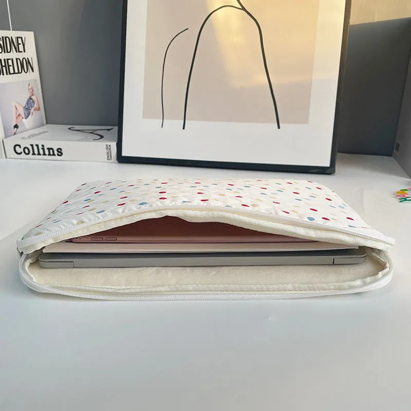Polka dot patterned laptop bag for women, shown in available sizes for 11-inch to 15.6-inch laptops.