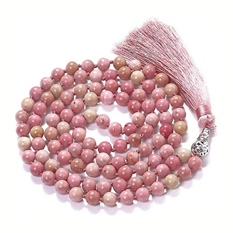 Long geometric agate tassel necklace with multi-coloured stones on a white background.