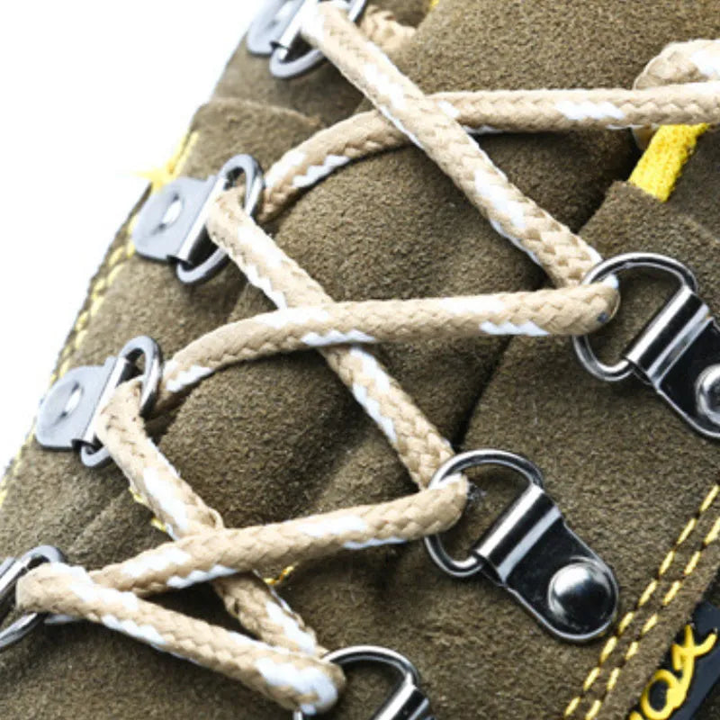 Bronze coloured low-cut cow suede leather safety shoes with a steel toe cap on a patterned non-slip sole.