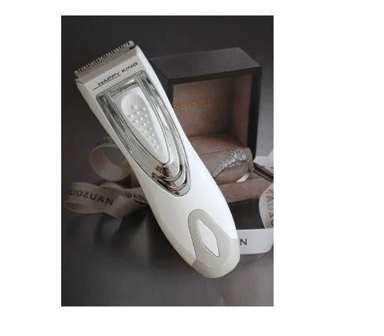 Children's barber scissors set with comb, limit combs, oil bottle, and brush in white
