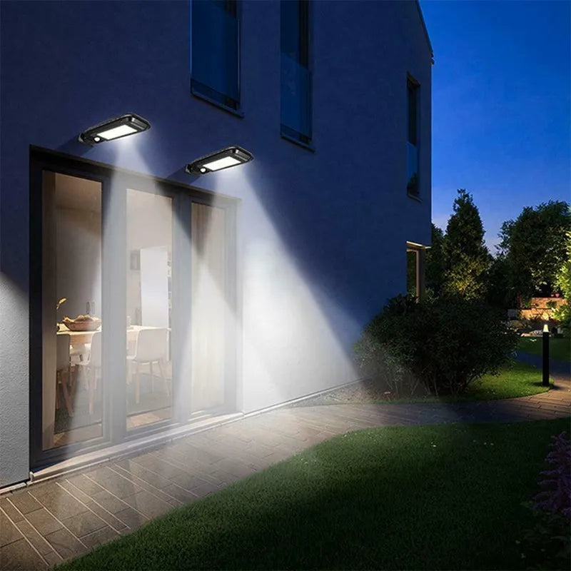 Solar human body induction wall lamp with 20 LED patches and ABS plastic housing on a white wall