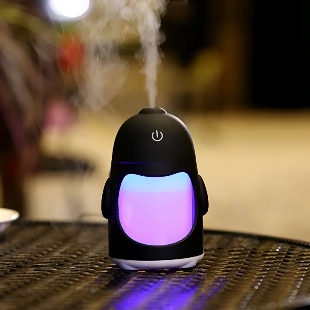 Penguin car humidifier in blue with 400ml transparent tank, USB cable and smiling face switch