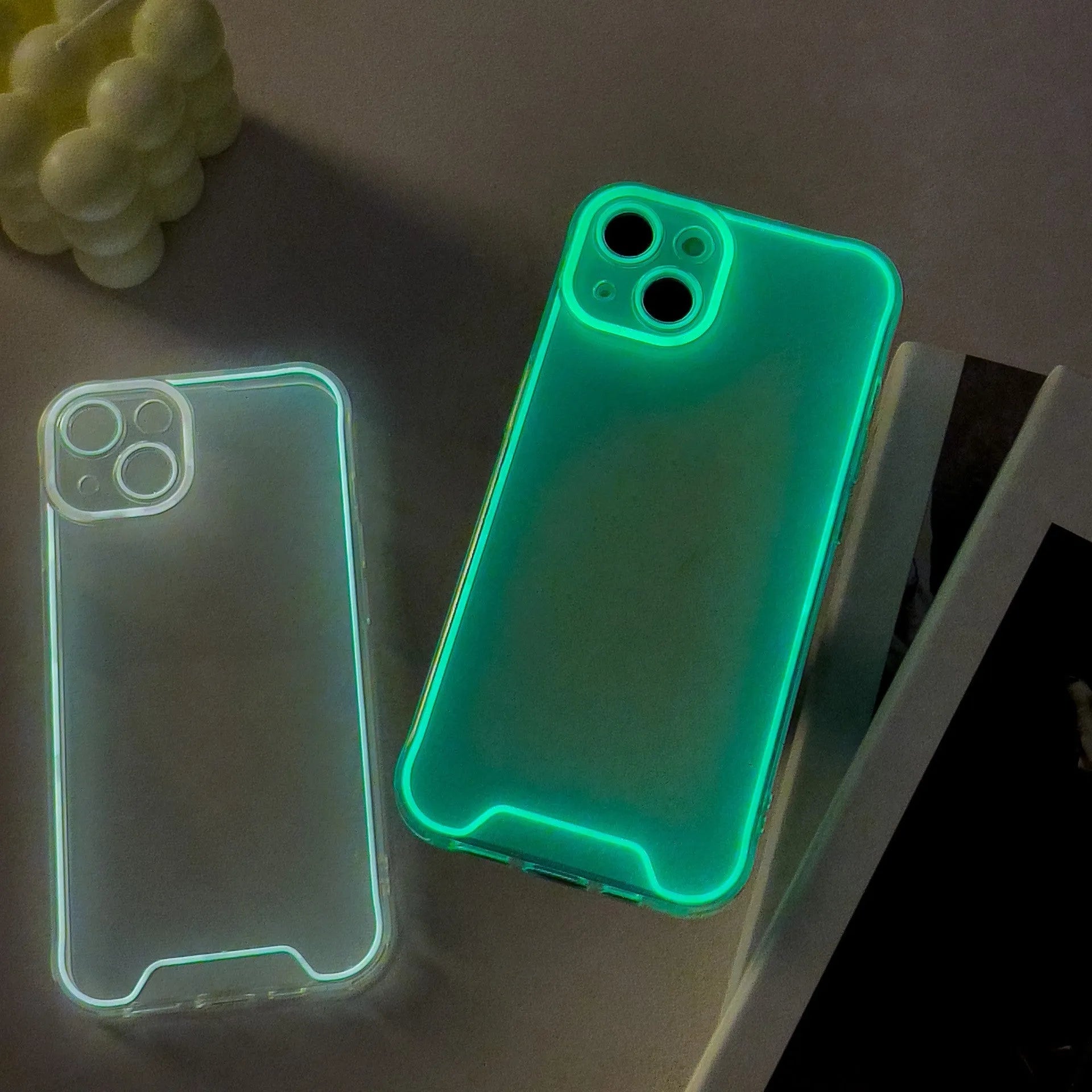 Glow in the dark Christmas soft TPU phone case for iPhone on a dark background, showing green colour.