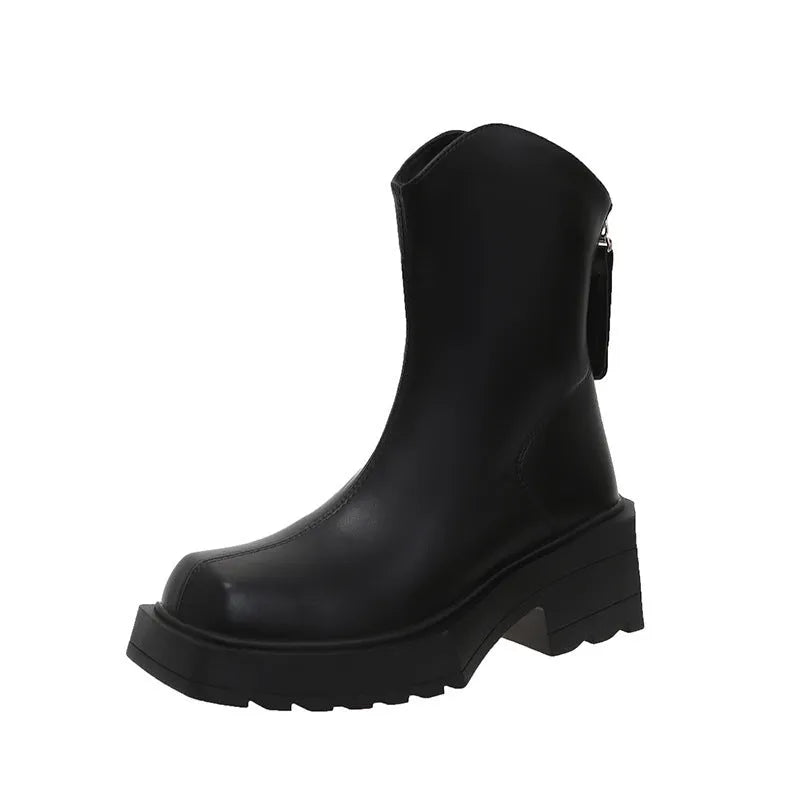 Black platform Martin boots for women with a square toe and back zipper on a rubber sole.